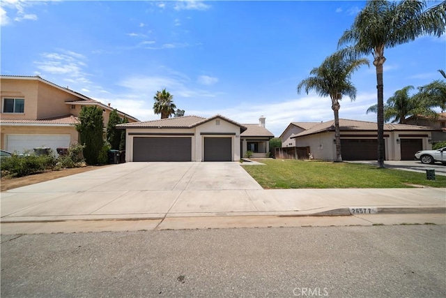 26577 Trumble Rd, Menifee, CA 92585 - ranch-style home featuring an attached garage, a front lawn, stucco siding, and a tile roof