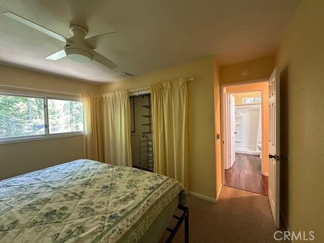 41141 Oak Dr, Forest Falls, CA 92339 - bedroom with carpet flooring, baseboards, and a ceiling fan