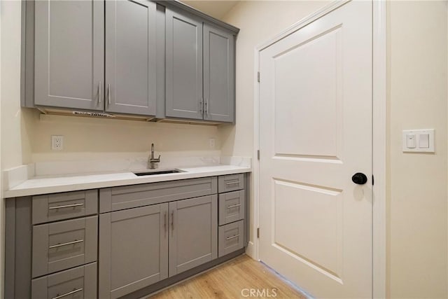2395 Tokay Ct, Paradise, CA 95969 - laundry area with a sink and light wood finished floors