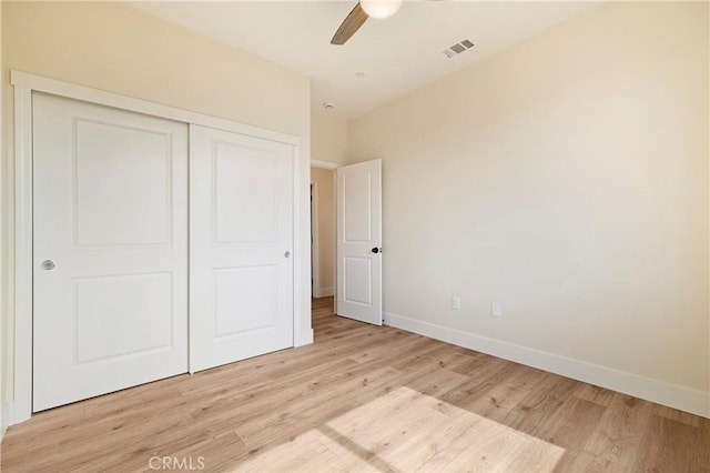 2395 Tokay Ct, Paradise, CA 95969 - unfurnished bedroom with light wood finished floors, a closet, baseboards, and ceiling fan