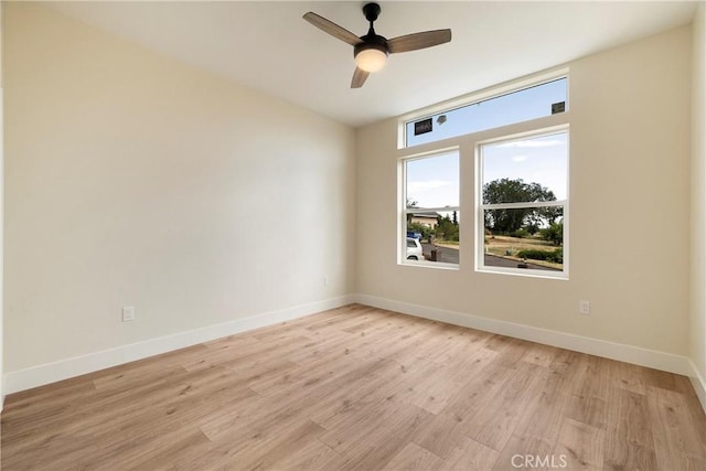 2395 Tokay Ct, Paradise, CA 95969 - unfurnished room featuring baseboards, light wood finished floors, and ceiling fan
