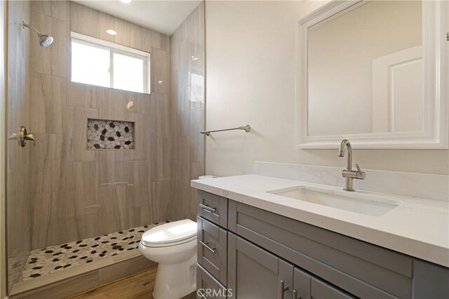 2395 Tokay Ct, Paradise, CA 95969 - bathroom featuring vanity, toilet, and a tile shower