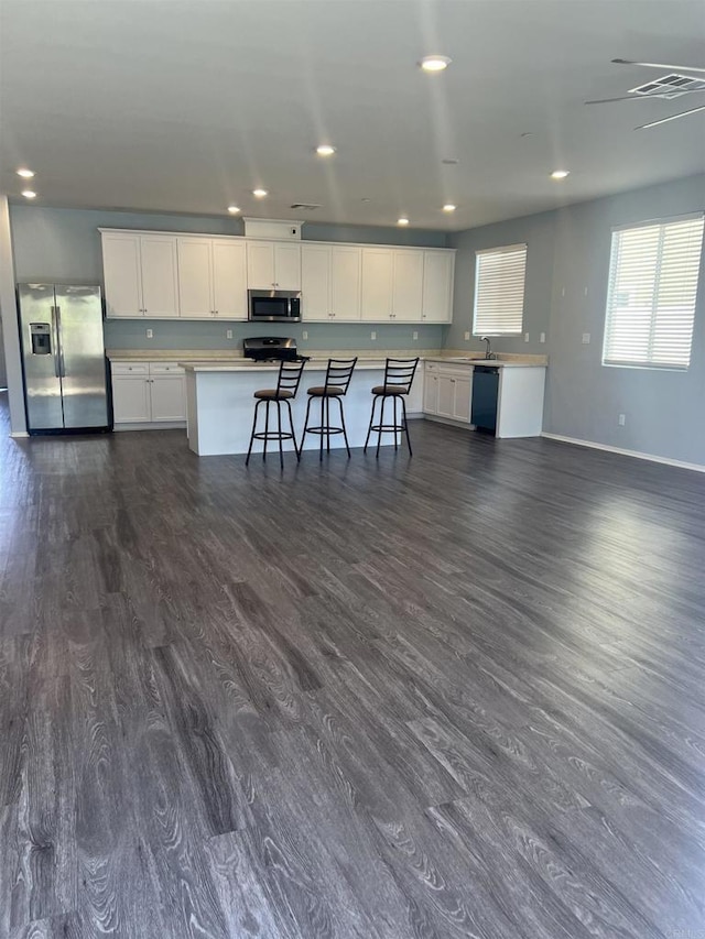 32323 Roman Warren Way, Winchester, CA 92596 - kitchen featuring stainless steel appliances, baseboards, dark wood-style floors, light countertops, and recessed lighting