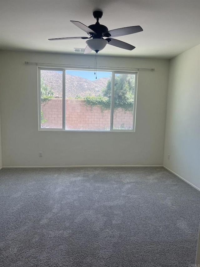 32323 Roman Warren Way, Winchester, CA 92596 - unfurnished room with carpet, a ceiling fan, and baseboards