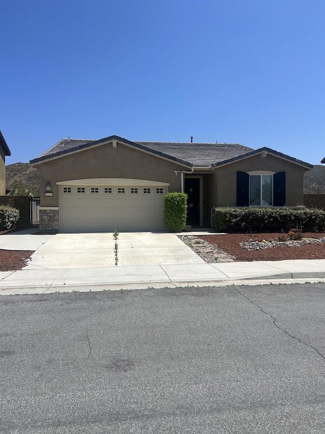 32323 Roman Warren Way, Winchester, CA 92596 - ranch-style house with stucco siding, an attached garage, and concrete driveway