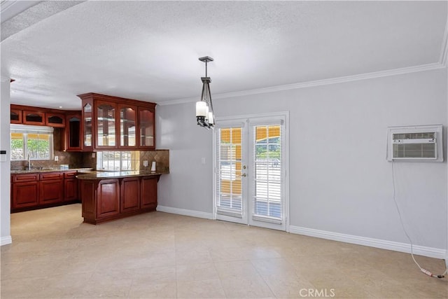5071 Bushnell Ave, Riverside, CA 92505 - kitchen featuring a wall unit AC, glass insert cabinets, healthy amount of natural light, backsplash, and crown molding