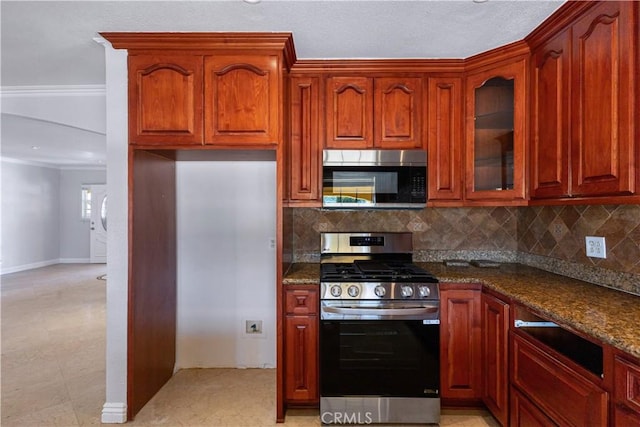 5071 Bushnell Ave, Riverside, CA 92505 - kitchen featuring appliances with stainless steel finishes, decorative backsplash, glass insert cabinets, dark stone counters, and crown molding