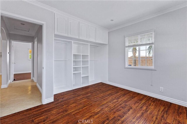 5071 Bushnell Ave, Riverside, CA 92505 - unfurnished bedroom featuring wood finished floors, ornamental molding, and a closet