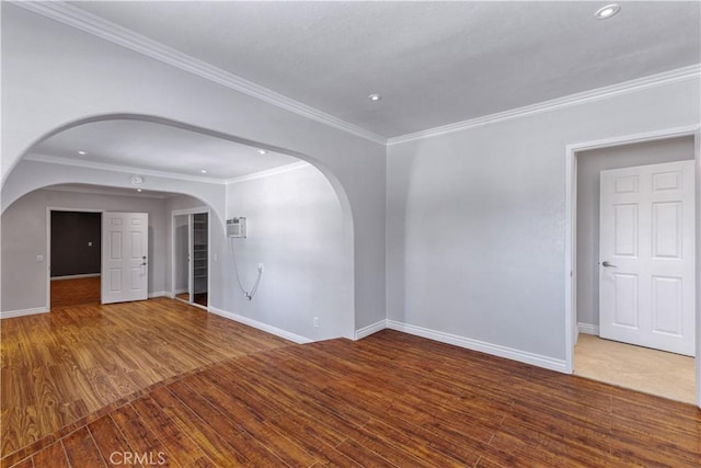 5071 Bushnell Ave, Riverside, CA 92505 - empty room with wood finished floors, ornamental molding, arched walkways, recessed lighting, and a wall mounted AC