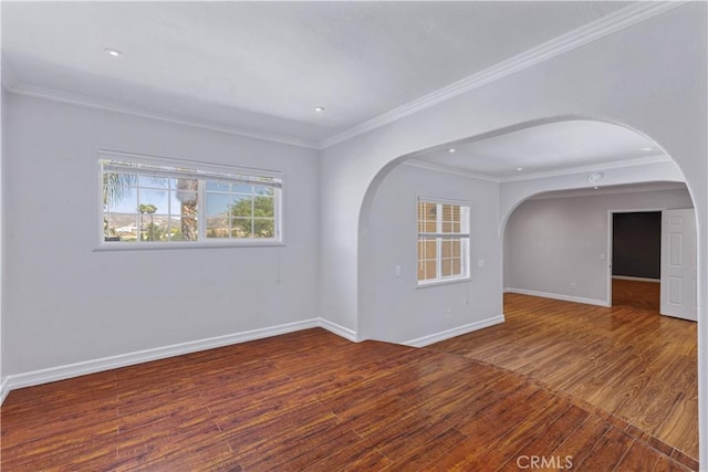 5071 Bushnell Ave, Riverside, CA 92505 - empty room with wood finished floors, ornamental molding, arched walkways, and recessed lighting
