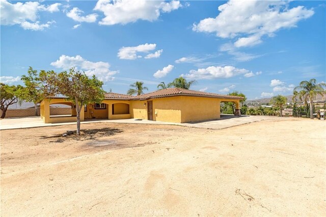 5071 Bushnell Ave, Riverside, CA 92505 - mediterranean / spanish house featuring stucco siding and a tile roof