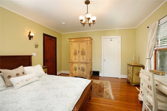 1321 Virginia Ave, Glendale, CA 91202 - bedroom with a chandelier, wood finished floors, crown molding, and baseboards