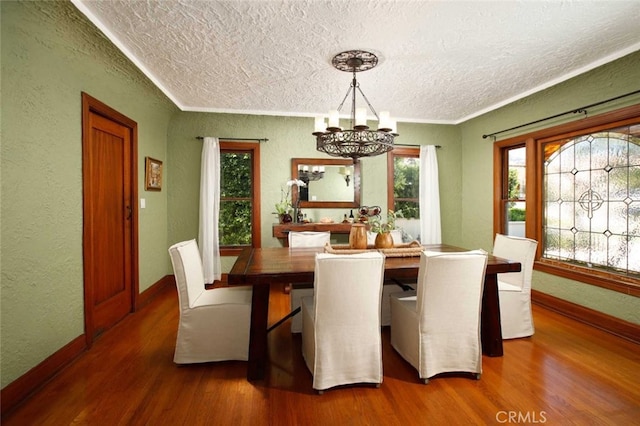 1321 Virginia Ave, Glendale, CA 91202 - dining space featuring a textured ceiling, wood finished floors, a chandelier, a textured wall, and baseboards