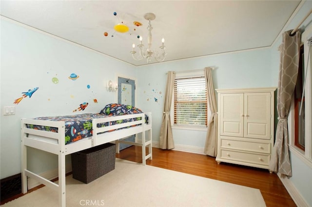 1321 Virginia Ave, Glendale, CA 91202 - bedroom with wood finished floors, a chandelier, and baseboards
