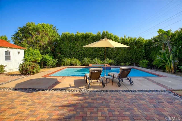 1321 Virginia Ave, Glendale, CA 91202 - view of pool with a patio area, view of wooded area, and a pool with connected hot tub