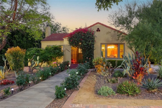 1321 Virginia Ave, Glendale, CA 91202 - mediterranean / spanish-style home featuring stucco siding, a chimney, and a tile roof