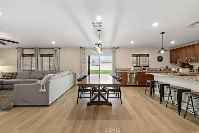 29377 Wyatt Earp Way, Winchester, CA 92596 - dining room with light wood-style floors, ceiling fan, and recessed lighting