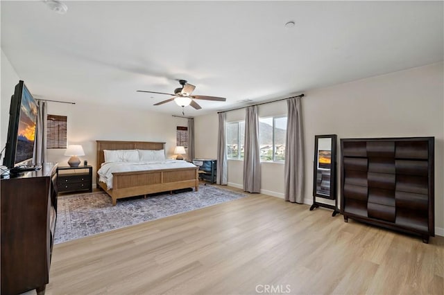 29377 Wyatt Earp Way, Winchester, CA 92596 - bedroom with light wood finished floors, baseboards, and a ceiling fan