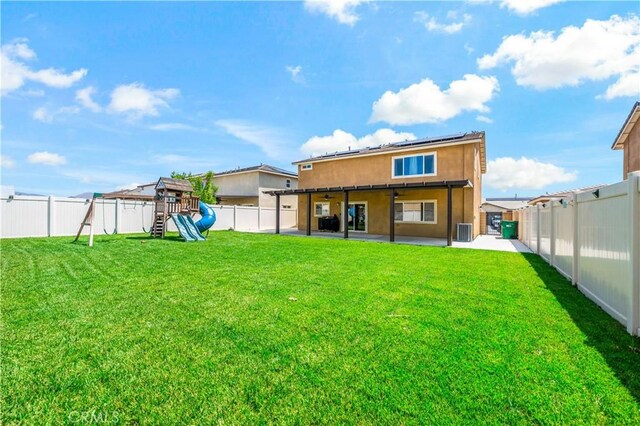 29377 Wyatt Earp Way, Winchester, CA 92596 - rear view of property featuring a playground, solar panels, a patio, cooling unit, and ceiling fan