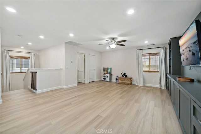 29377 Wyatt Earp Way, Winchester, CA 92596 - unfurnished living room featuring plenty of natural light, a ceiling fan, light wood-type flooring, baseboards, and recessed lighting