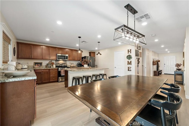 29377 Wyatt Earp Way, Winchester, CA 92596 - dining area with light wood-style flooring and recessed lighting