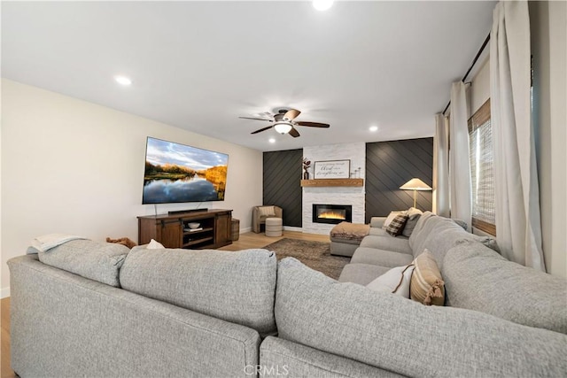 29377 Wyatt Earp Way, Winchester, CA 92596 - living room featuring wood finished floors, baseboards, recessed lighting, a ceiling fan, and a large fireplace