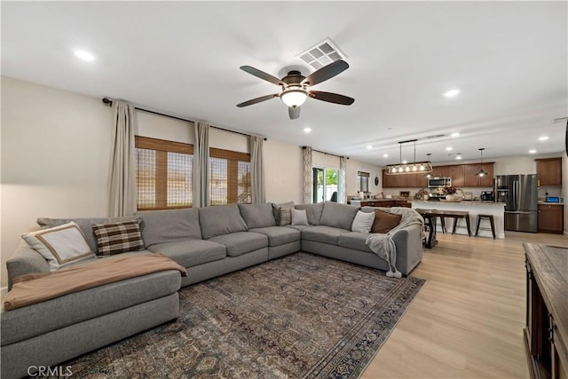 29377 Wyatt Earp Way, Winchester, CA 92596 - living room with a ceiling fan, recessed lighting, and light wood-style flooring