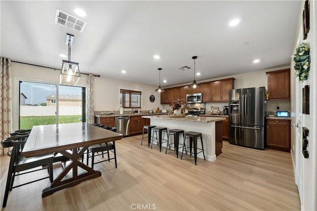 29377 Wyatt Earp Way, Winchester, CA 92596 - dining space featuring light wood-style flooring and recessed lighting