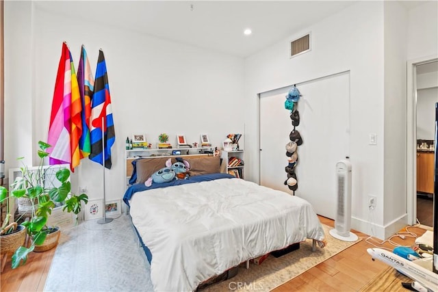 460 S Spring St Unit 613, Los Angeles, CA 90013 - bedroom with wood finished floors, recessed lighting, and a closet