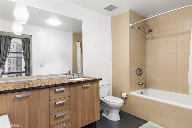 460 S Spring St Unit 613, Los Angeles, CA 90013 - full bathroom featuring toilet, tiled shower / bath combo, and vanity