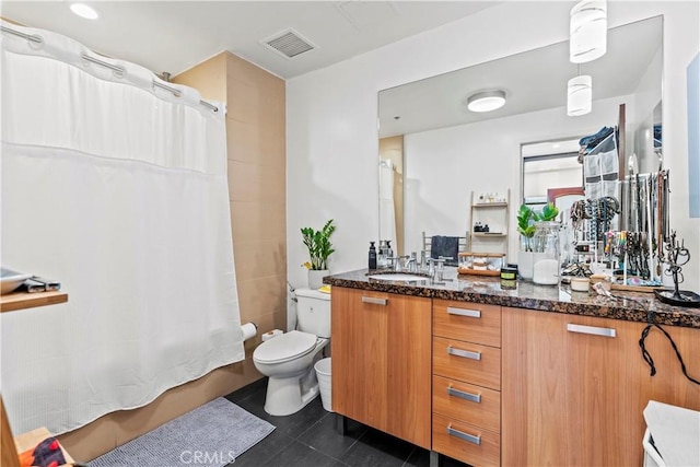 460 S Spring St Unit 613, Los Angeles, CA 90013 - bathroom with vanity, toilet, tile patterned flooring, and shower / bath combo with shower curtain