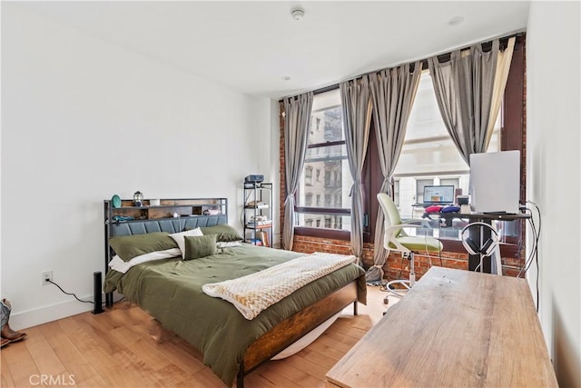 460 S Spring St Unit 613, Los Angeles, CA 90013 - bedroom with wood-type flooring and baseboards