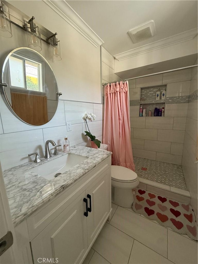 6867 Weaver St, Riverside, CA 92504 - bathroom with ornamental molding, vanity, a stall shower, toilet, and tile patterned floors