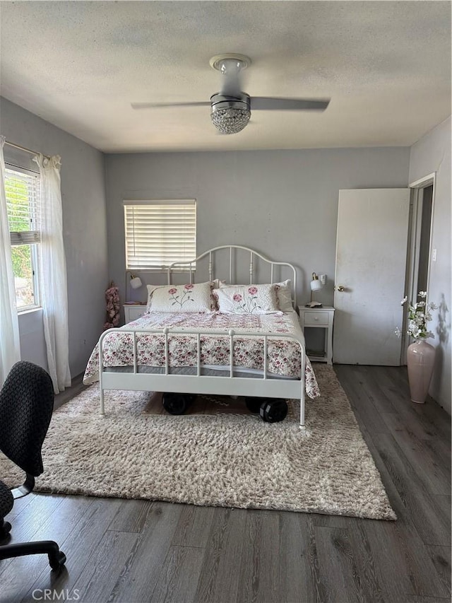 6867 Weaver St, Riverside, CA 92504 - bedroom featuring wood finished floors, a textured ceiling, and a ceiling fan