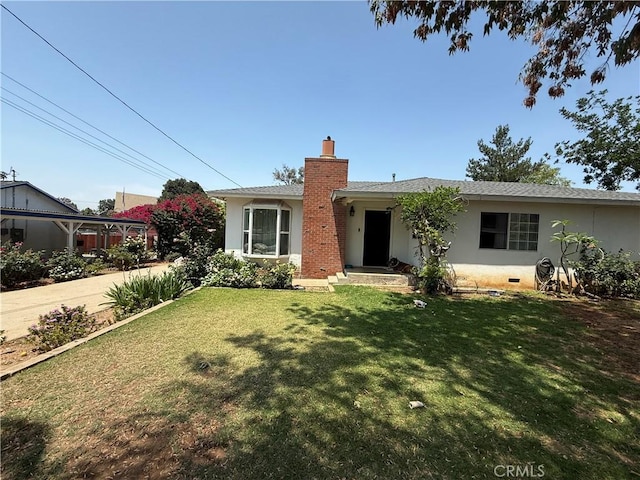6867 Weaver St, Riverside, CA 92504 - ranch-style home featuring stucco siding, a chimney, and a front yard