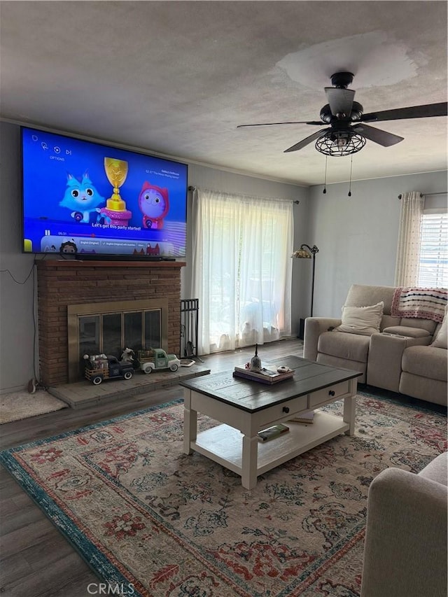 6867 Weaver St, Riverside, CA 92504 - living area with ceiling fan, wood finished floors, and a fireplace