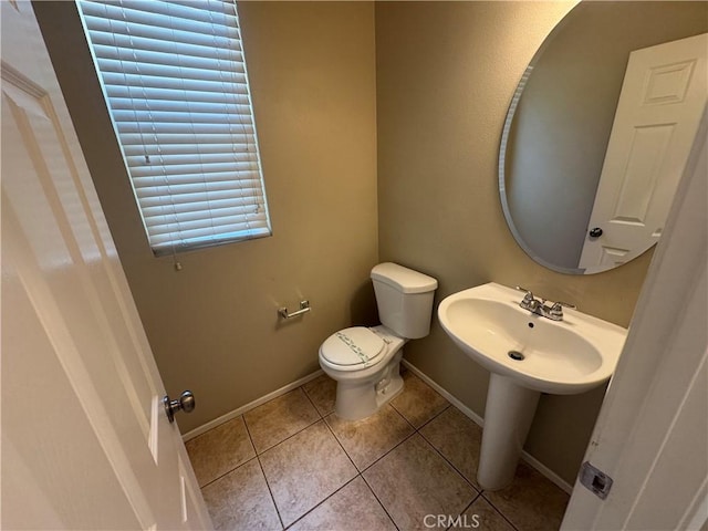 9757 Edenbrook Dr, Riverside, CA 92503 - half bathroom with toilet, tile patterned flooring, and baseboards