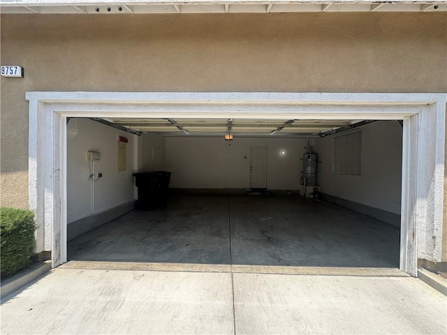 9757 Edenbrook Dr, Riverside, CA 92503 - garage featuring secured water heater
