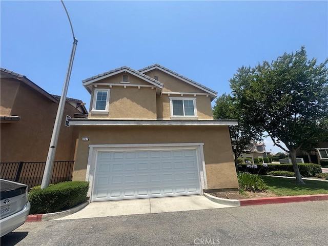 9757 Edenbrook Dr, Riverside, CA 92503 - traditional-style home featuring stucco siding, driveway, and a garage