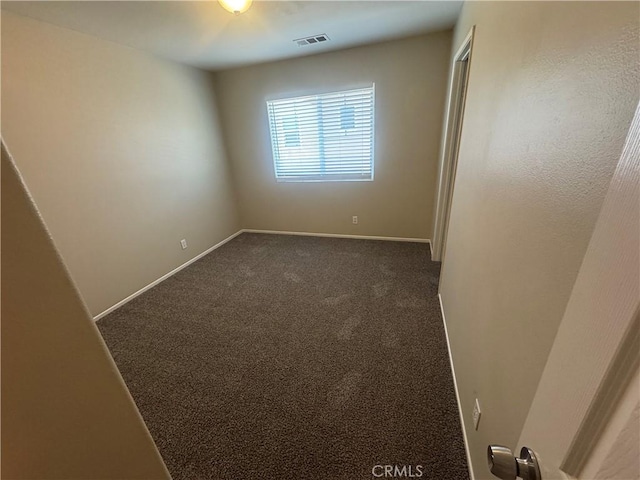9757 Edenbrook Dr, Riverside, CA 92503 - spare room with dark carpet and baseboards