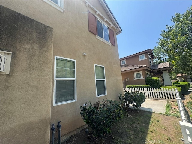 9757 Edenbrook Dr, Riverside, CA 92503 - view of side of property with stucco siding