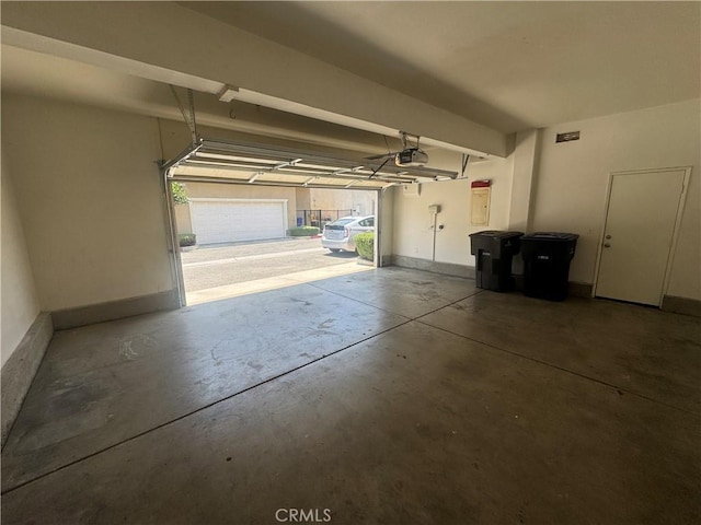 9757 Edenbrook Dr, Riverside, CA 92503 - garage featuring a garage door opener
