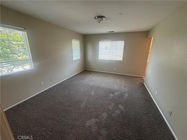 9757 Edenbrook Dr, Riverside, CA 92503 - carpeted spare room featuring baseboards