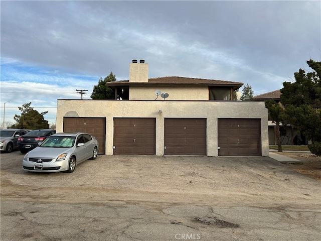 16585 Green Tree Blvd, Victorville, CA 92395 - view of front of home with a chimney and stucco siding