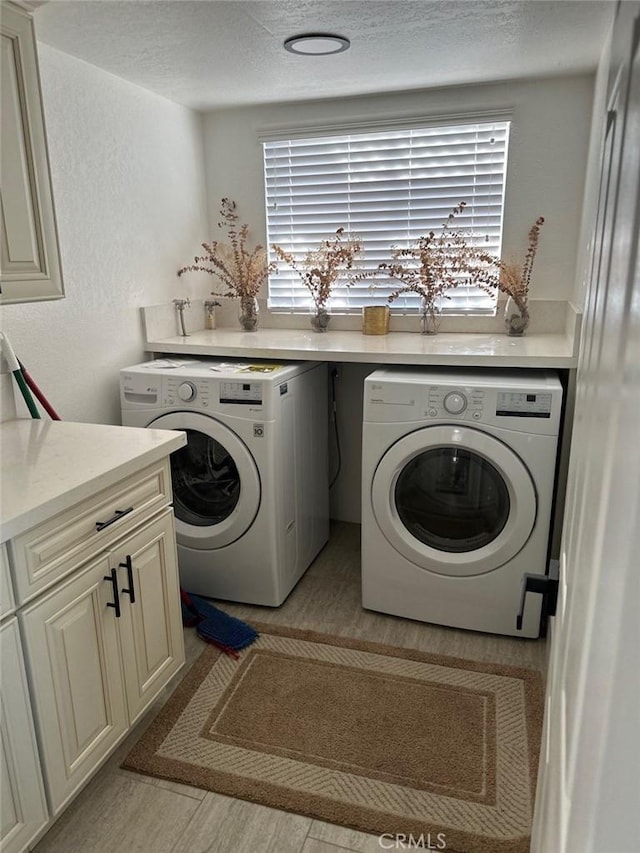 20515 Bushton Pl, Perris, CA 92570 - laundry room with washing machine and dryer, a textured ceiling, and plenty of natural light