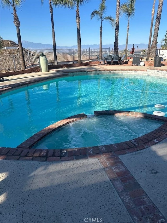 20515 Bushton Pl, Perris, CA 92570 - view of pool with a pool with connected hot tub and a mountain view