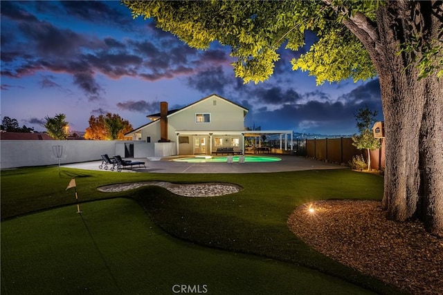 6021 Saddletree Ln, Yorba Linda, CA 92886 - rear view of property with a putting area, a fenced backyard, and a patio area