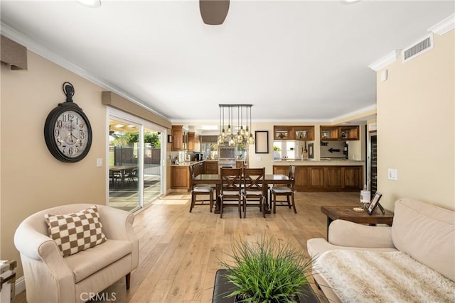 6021 Saddletree Ln, Yorba Linda, CA 92886 - living room featuring light wood-style flooring and crown molding