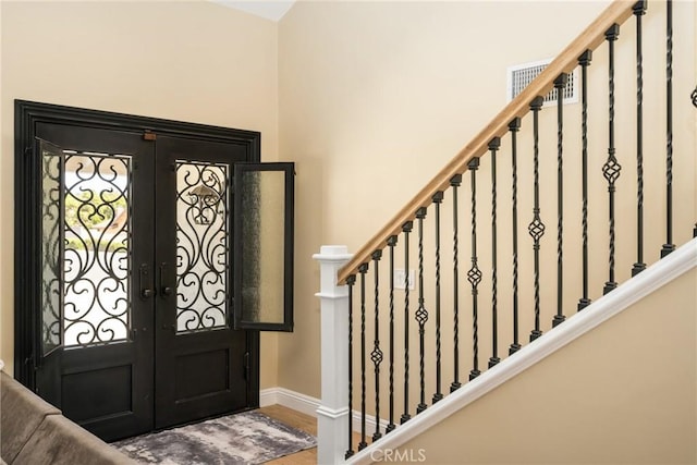6021 Saddletree Ln, Yorba Linda, CA 92886 - entryway featuring french doors, stairway, and wood finished floors