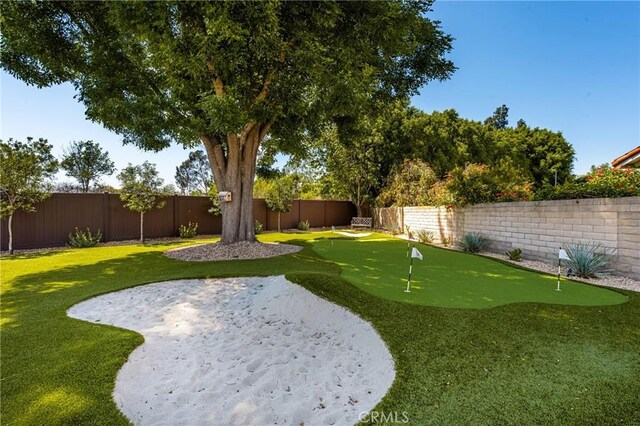 6021 Saddletree Ln, Yorba Linda, CA 92886 - fenced backyard featuring a putting area